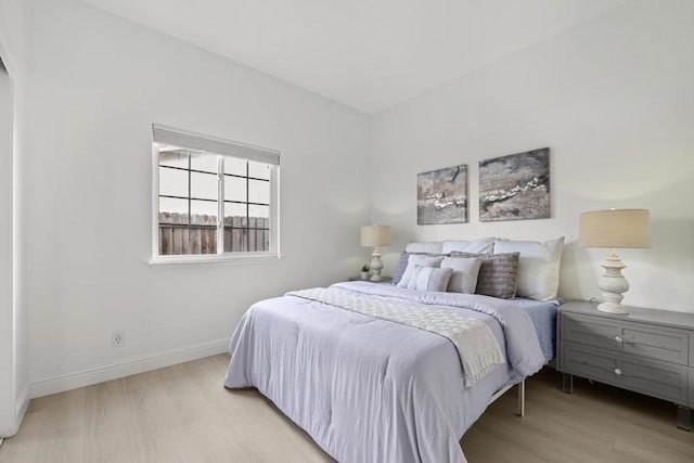 bedroom with light hardwood / wood-style floors