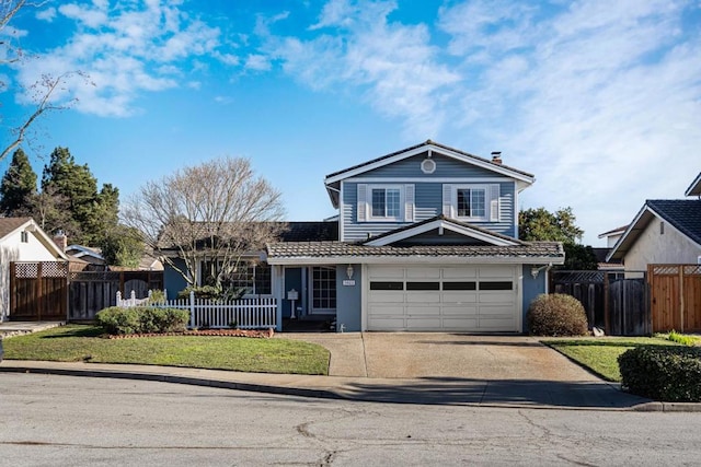 view of property with a garage and a front lawn