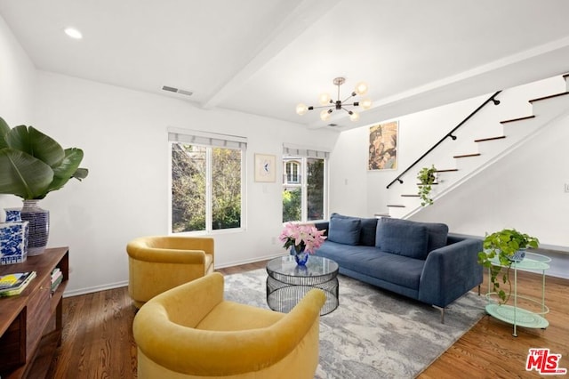 living room with beamed ceiling, hardwood / wood-style flooring, and an inviting chandelier