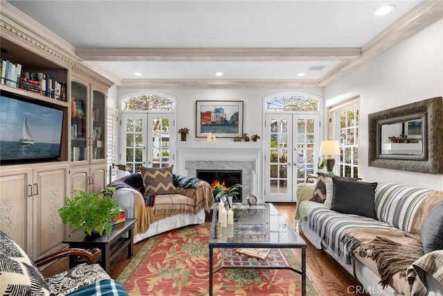 living room with dark wood-type flooring, ornamental molding, french doors, and beamed ceiling