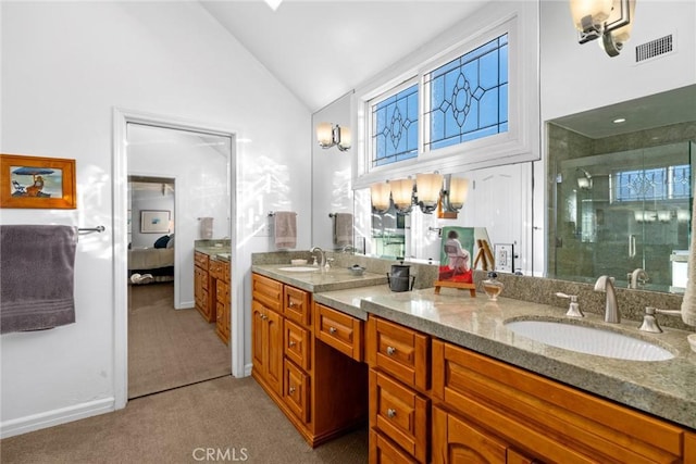 bathroom with vanity, a shower with shower door, and high vaulted ceiling