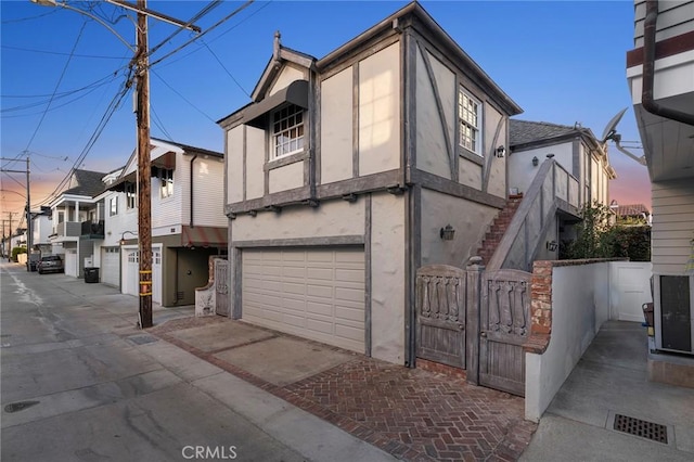 property exterior at dusk with a garage