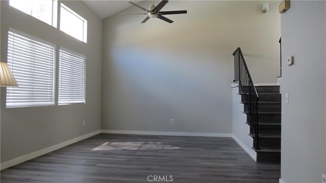 empty room featuring ceiling fan and dark hardwood / wood-style flooring