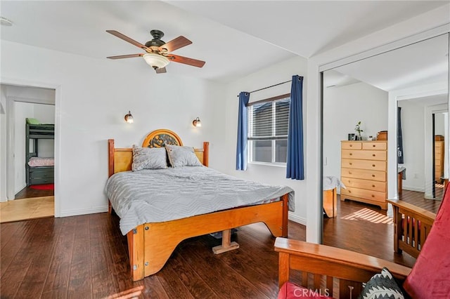 bedroom with wood-type flooring, baseboards, and ceiling fan