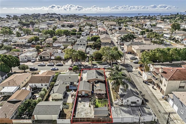 bird's eye view featuring a residential view and a water view