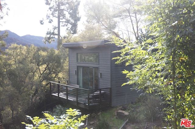 view of outbuilding with a mountain view