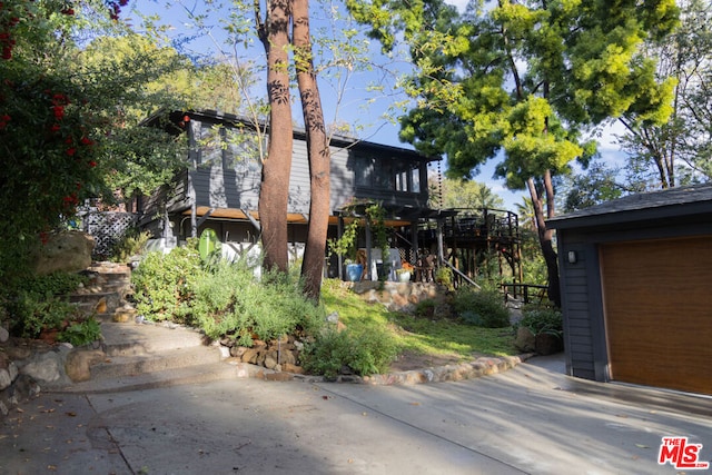 view of side of property featuring an outbuilding and a garage