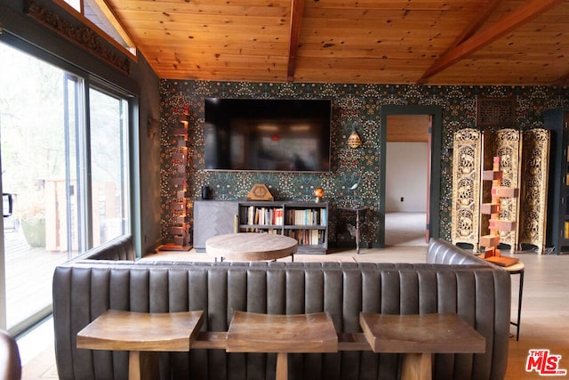 bar featuring lofted ceiling, radiator heating unit, light hardwood / wood-style floors, and wooden ceiling