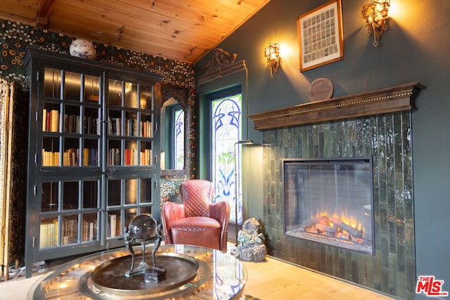 sitting room featuring wood ceiling, vaulted ceiling, and hardwood / wood-style flooring