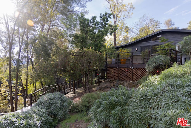 view of yard featuring a wooden deck