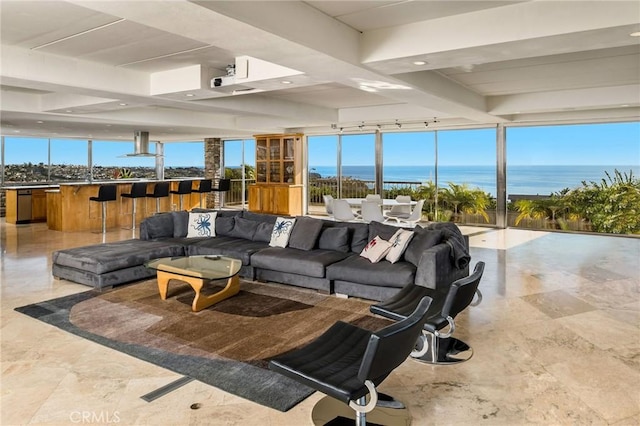 living room with plenty of natural light and a water view