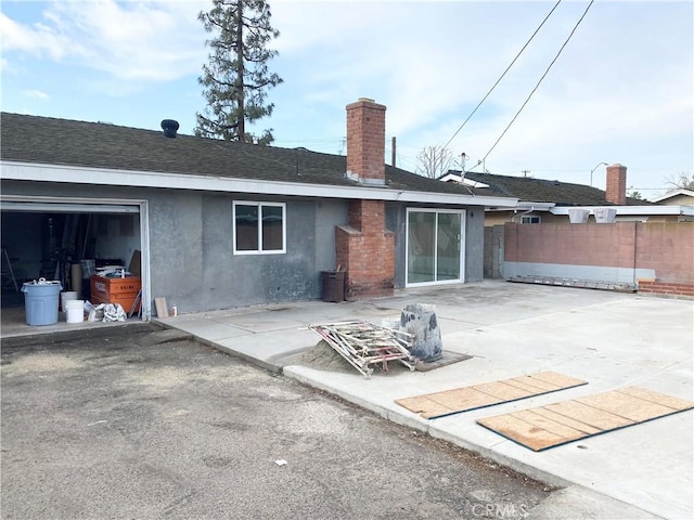 back of property featuring a patio