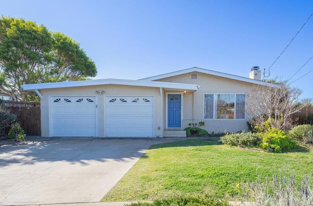 ranch-style home featuring a garage and a front lawn