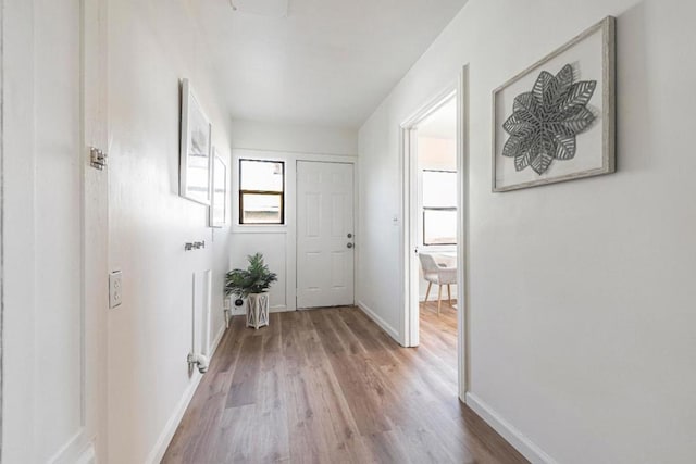 hall with light hardwood / wood-style floors