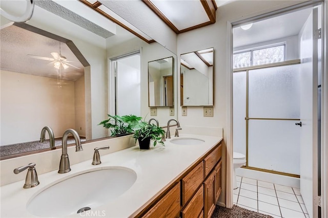 bathroom with vanity, an enclosed shower, ceiling fan, toilet, and tile patterned floors