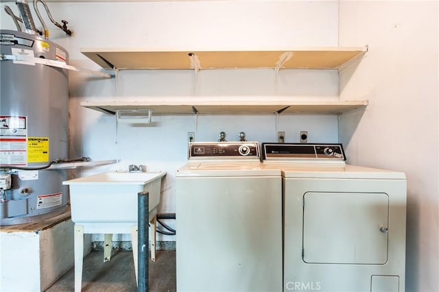 laundry area featuring secured water heater and washer and clothes dryer