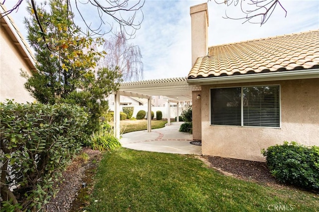 view of yard with a pergola and a patio