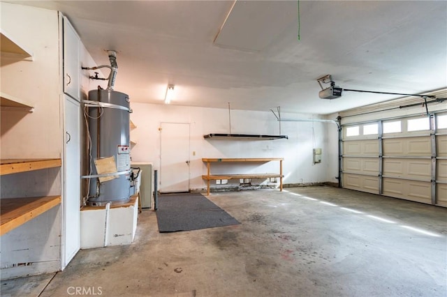 garage with a garage door opener and water heater