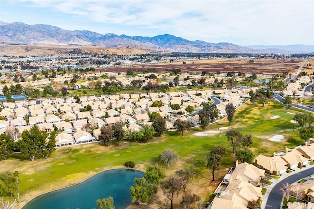 aerial view featuring a water and mountain view