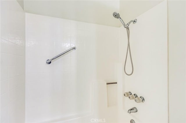 bathroom with shower / washtub combination