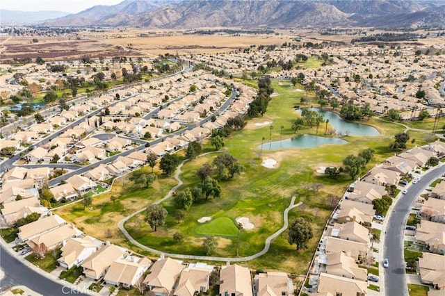 birds eye view of property featuring a water and mountain view