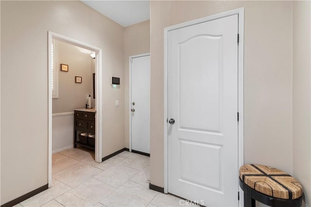 hall with light tile patterned flooring