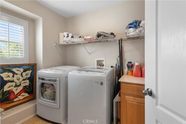 laundry area with washing machine and dryer