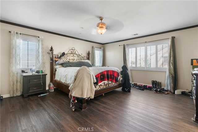 bedroom featuring ornamental molding, dark hardwood / wood-style floors, and ceiling fan