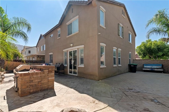 rear view of property with a patio area