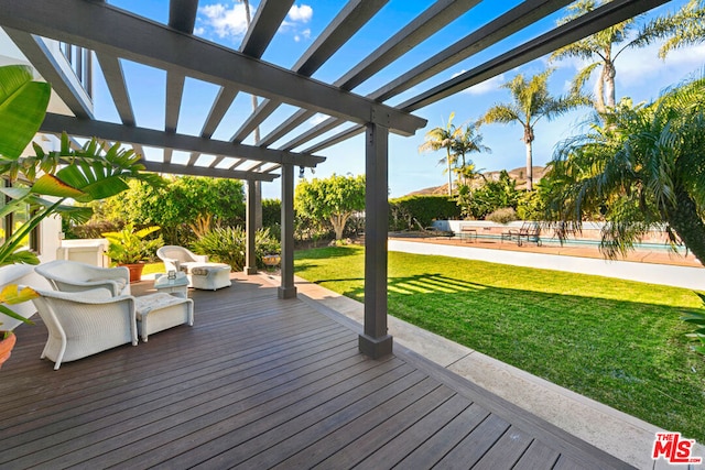 wooden terrace with a yard and a pergola