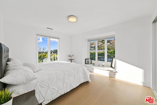 bedroom featuring hardwood / wood-style flooring