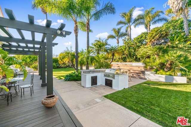 view of patio featuring a wooden deck, area for grilling, grilling area, and a pergola