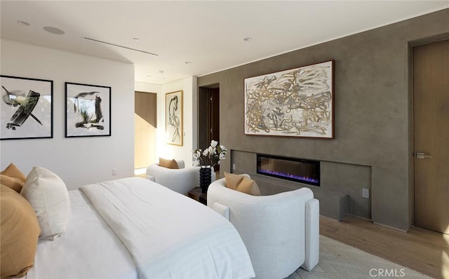 bedroom with light wood-type flooring