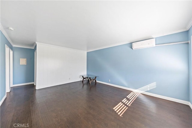 unfurnished room featuring ornamental molding, dark hardwood / wood-style floors, and a wall mounted AC