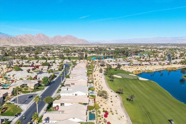 birds eye view of property featuring a water and mountain view