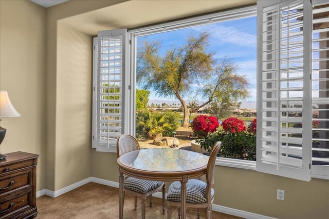 sitting room with plenty of natural light and light tile patterned floors