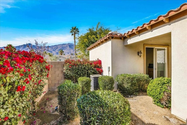 view of yard with a mountain view and central AC