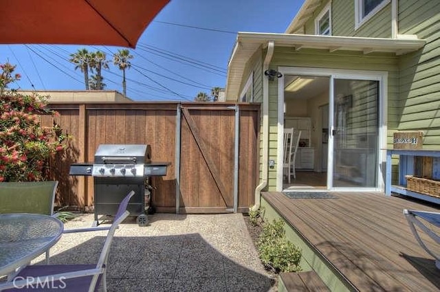 wooden deck featuring area for grilling