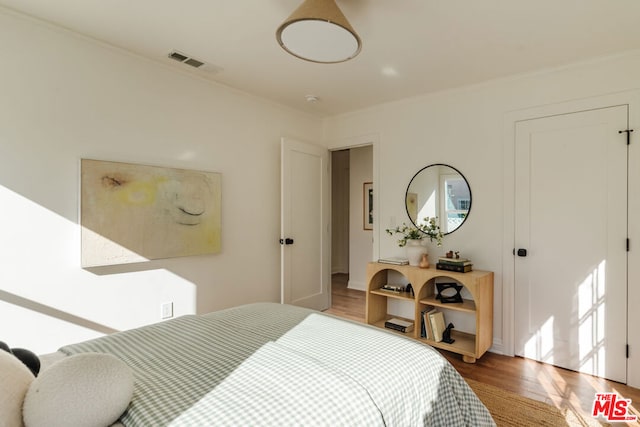 bedroom featuring hardwood / wood-style floors