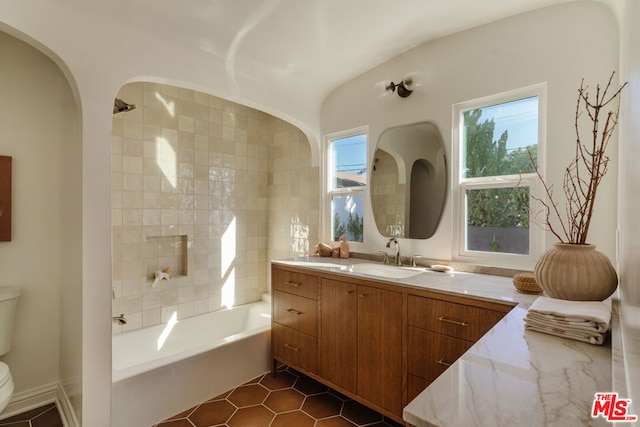 bathroom featuring vanity, tile patterned floors, and toilet