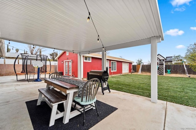 view of patio featuring an outbuilding and grilling area