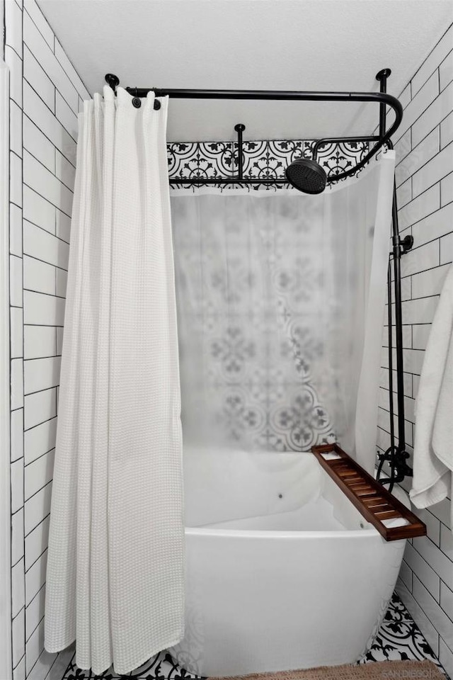 bathroom featuring shower / bath combination with curtain