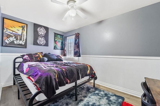 bedroom featuring hardwood / wood-style floors and ceiling fan