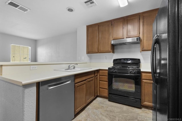 kitchen with sink, kitchen peninsula, and black appliances