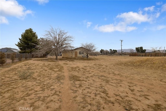 view of yard with a rural view