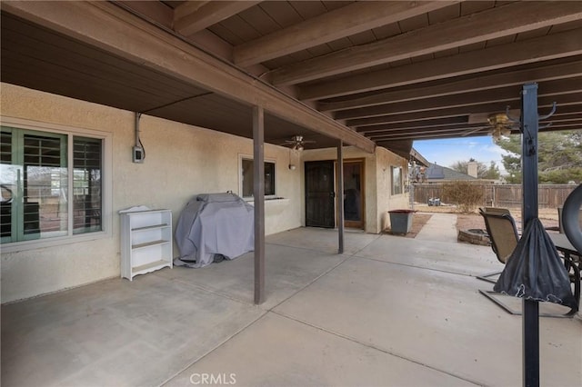 view of patio featuring ceiling fan