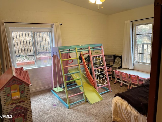 carpeted bedroom featuring lofted ceiling