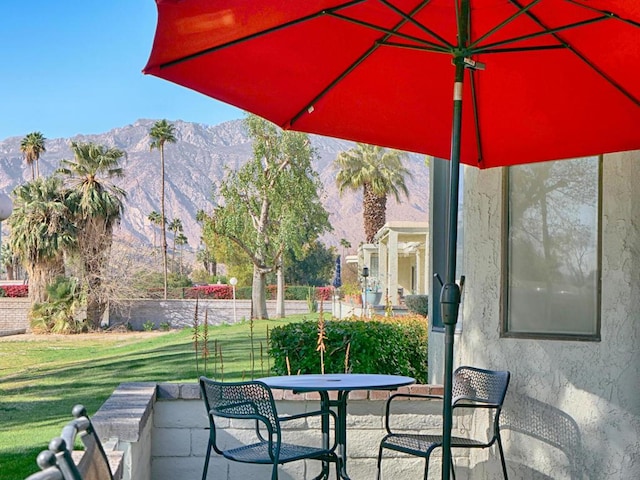 view of patio / terrace featuring a mountain view