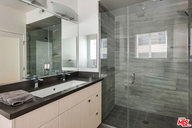 bathroom with vanity and an enclosed shower