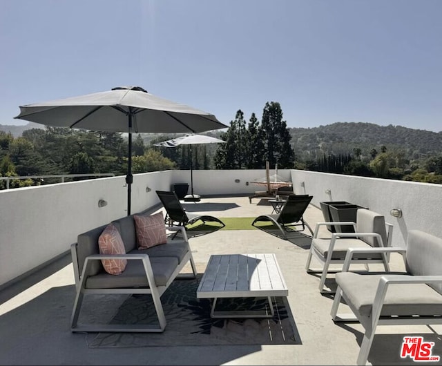 view of patio / terrace with a mountain view